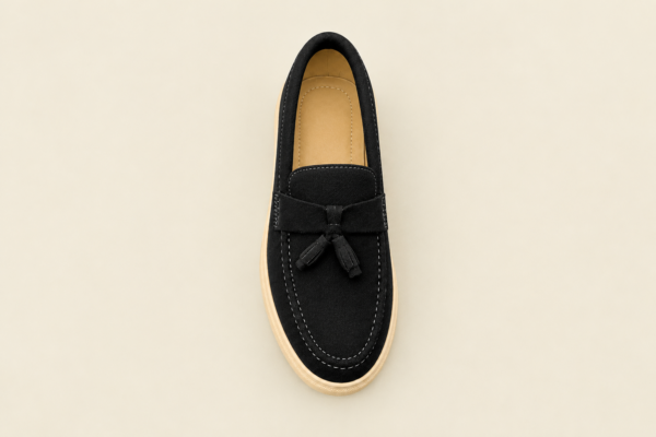 Black Tassel Loafer on Cream Background thriftedloop